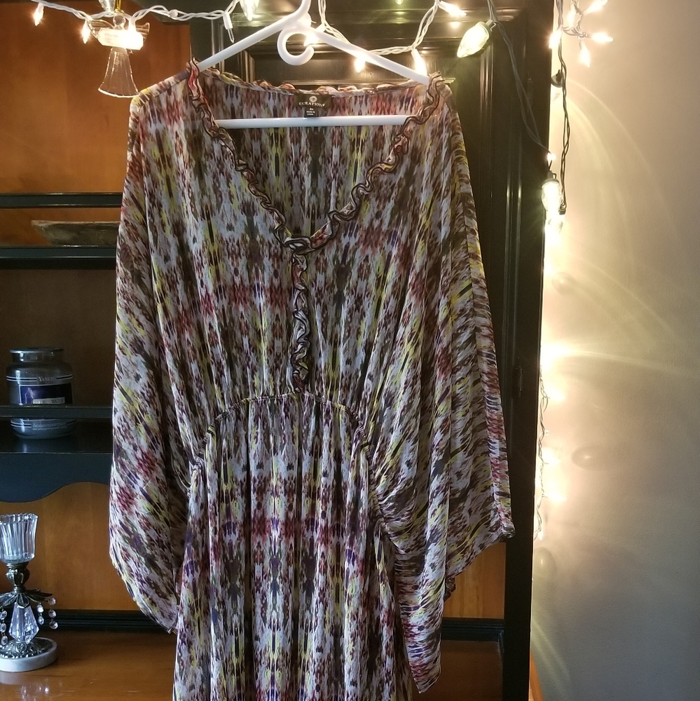 Beautiful size 3x polyester, cold water wash dress. I'm 5'7" mid calf length